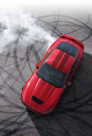 Overhead view of a 2024 Ford Mustang® model with tire tracks on pavement | Capital City Ford in Pierre SD