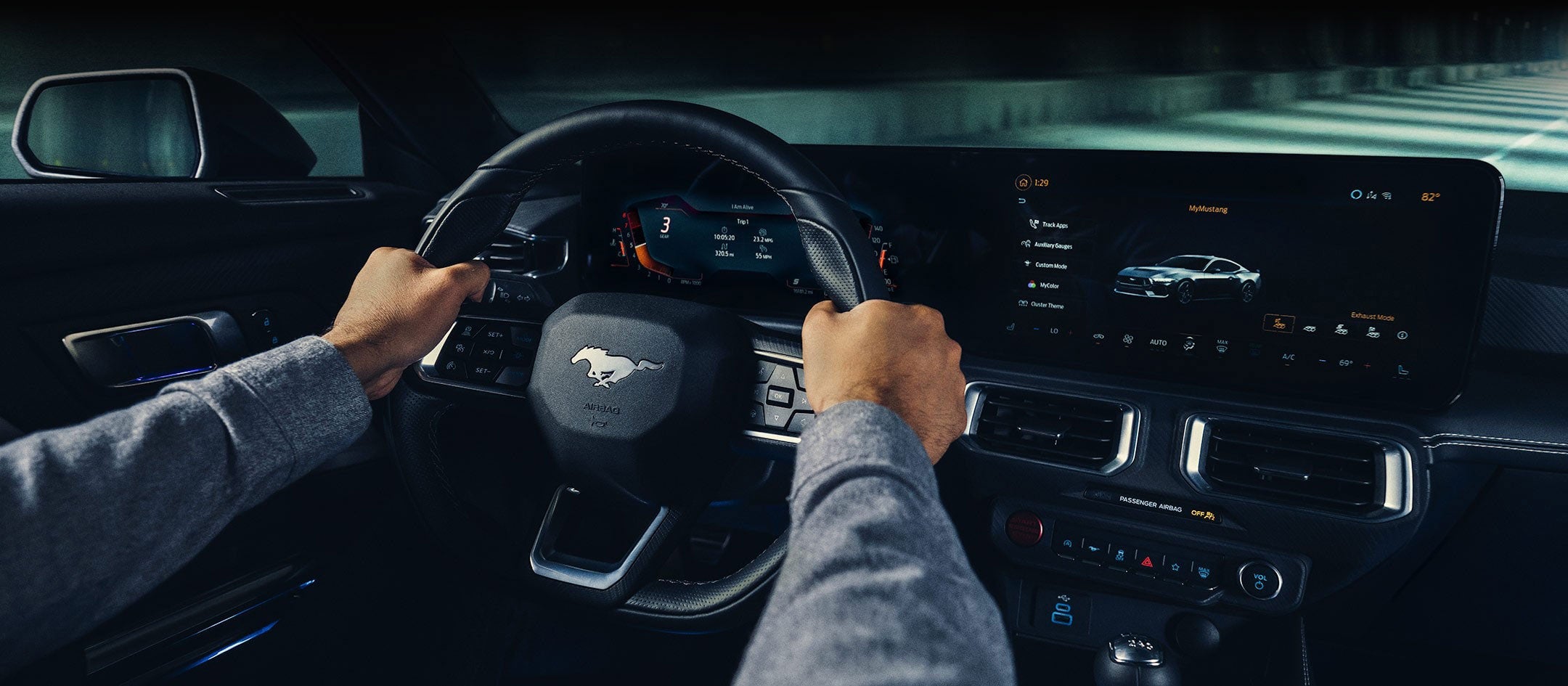 A 2024 Ford Mustang® model interior with a person driving | Capital City Ford in Pierre SD